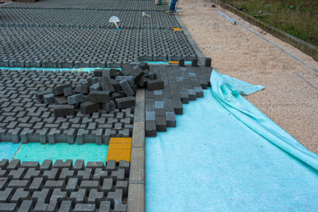 Stacks of interlocking stones for installing driveway landscaping