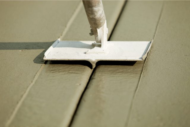 Groover Slicing Wet Freshly Poured Concrete